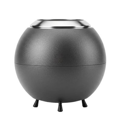 Spherical gray firepit with a metallic rim on a white background